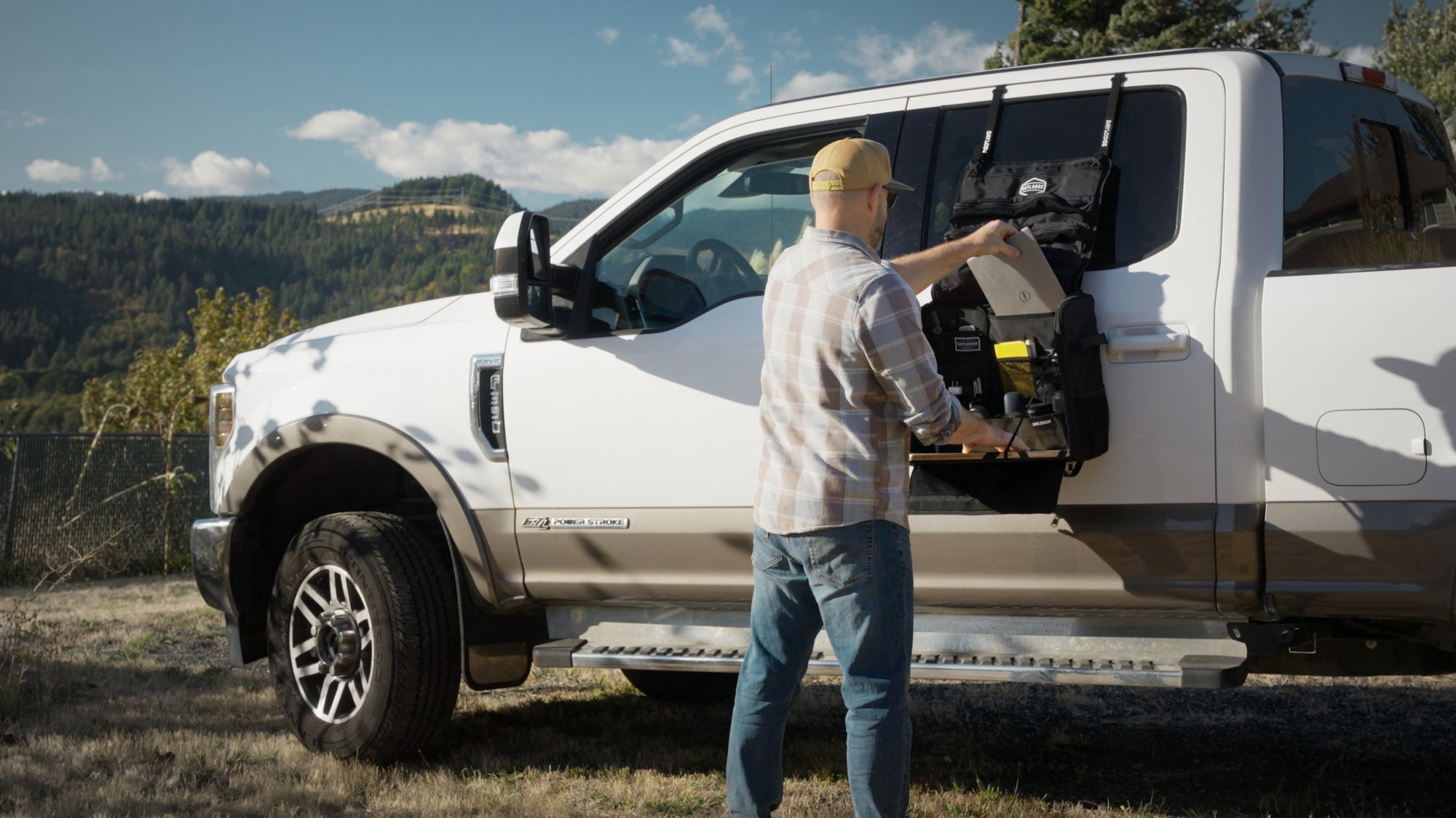 Workspace bag set up as a mobile office on a truck tailgate