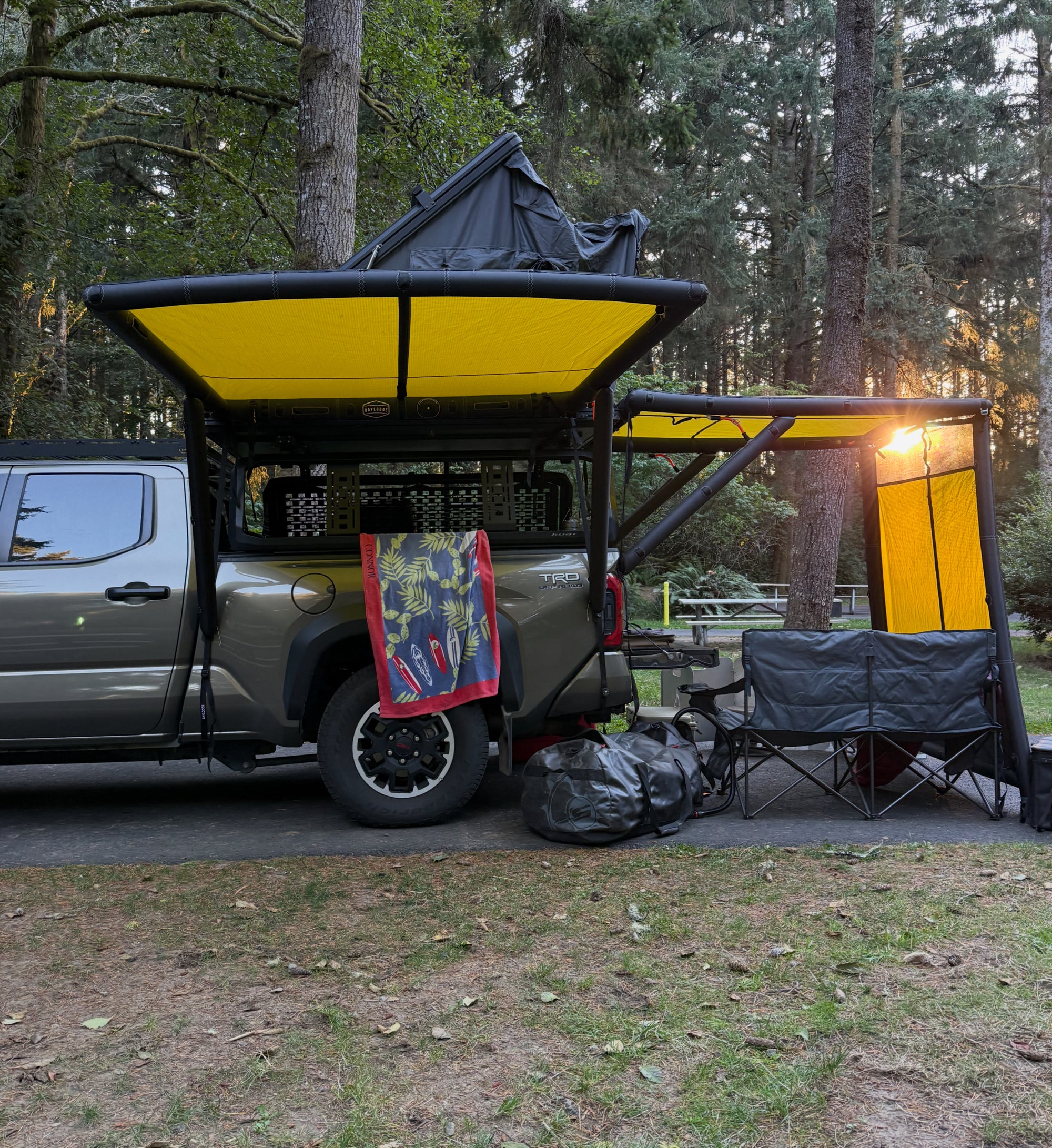 AirHaven awning and Workspace kitchen set up at a creekside camp