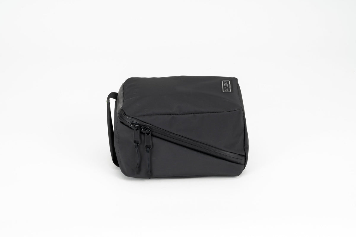 Daylodge Cold Cube soft cooler lying flat, showing the YKK zipper and quick-access pocket