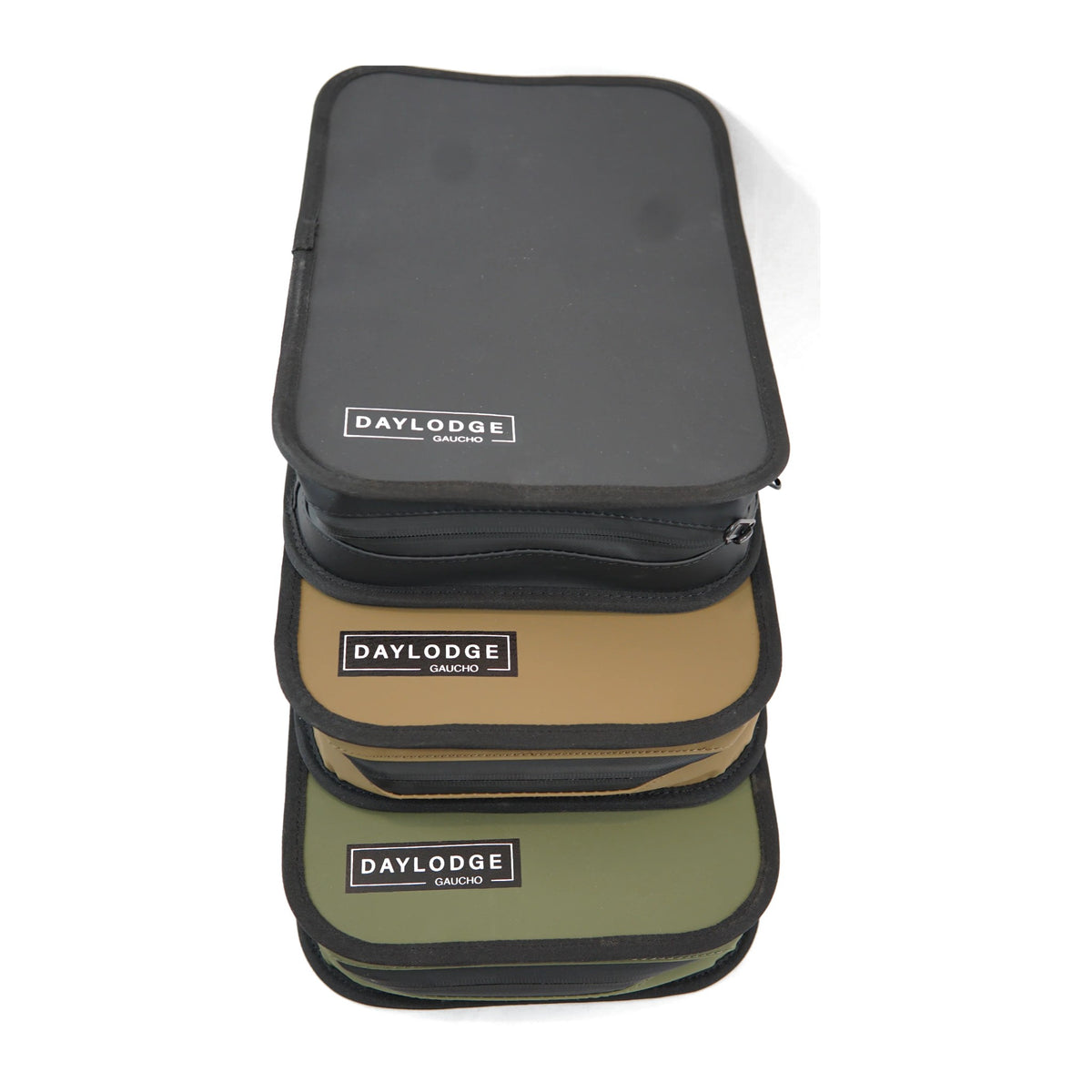 Three Gaucho cases stacked: Black, Khaki Brown and Sage Green