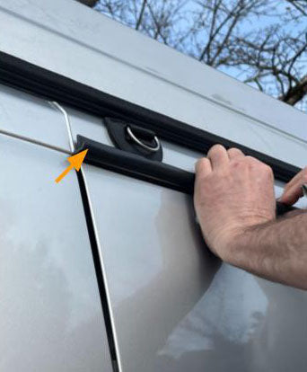 Flat hook seated in the roof gutter