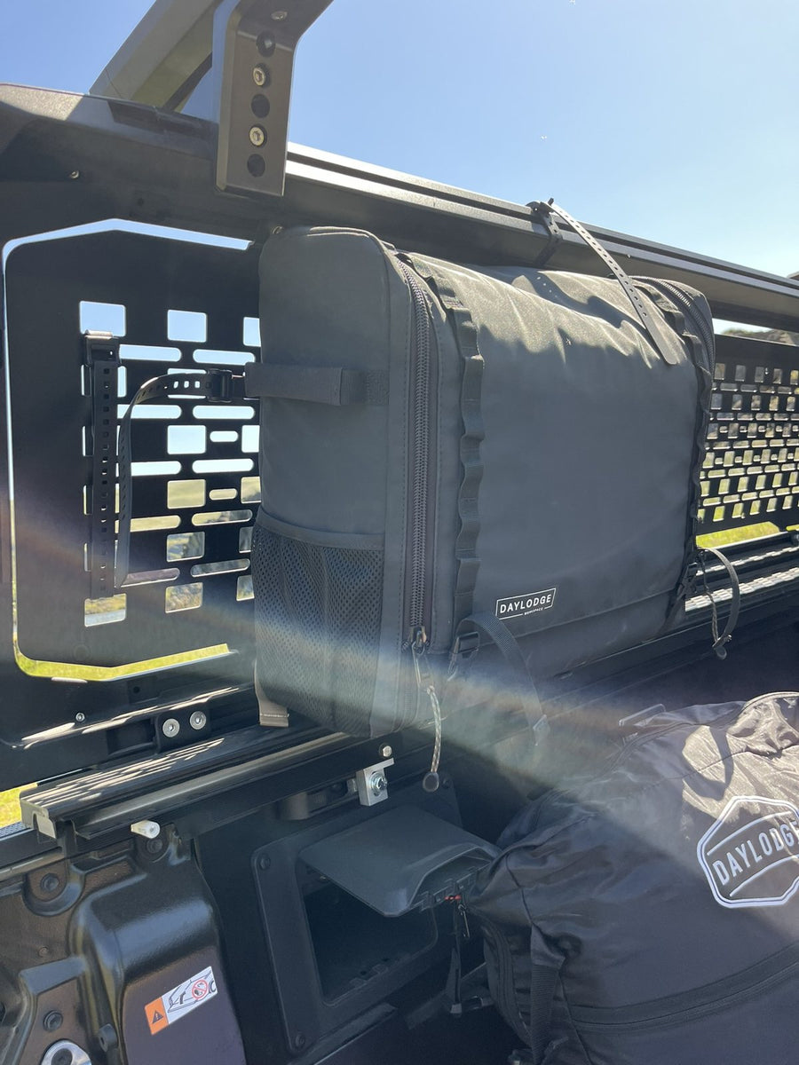 Workspace strapped to a truck bed rack with FlexMount rubber straps
