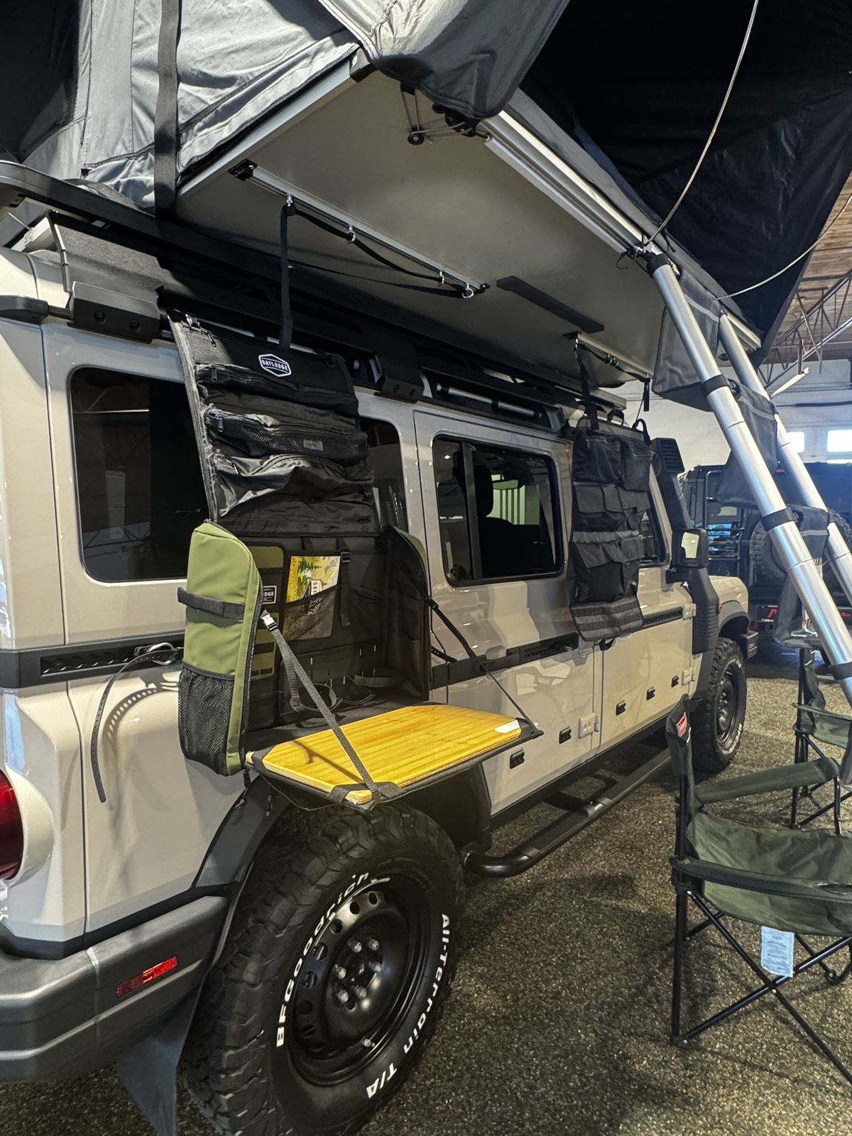 Workspace hanging from a roof-top tent on an Ineos Grenadier