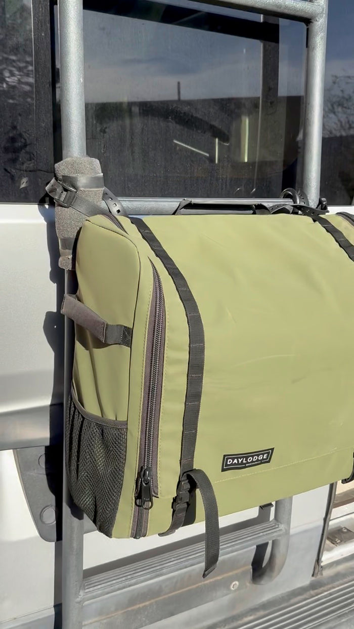 Workspace strapped to a van ladder with FlexMount Rubber Straps