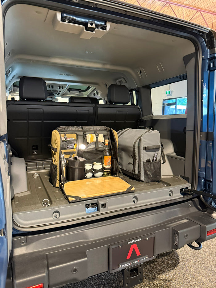 Workspace open on the cargo floor of an Ineos Grenadier, set up as a bar