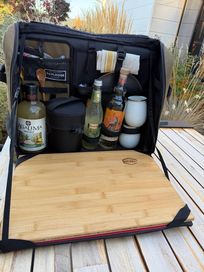 Workspace open on a patio table set up as a margarita bar