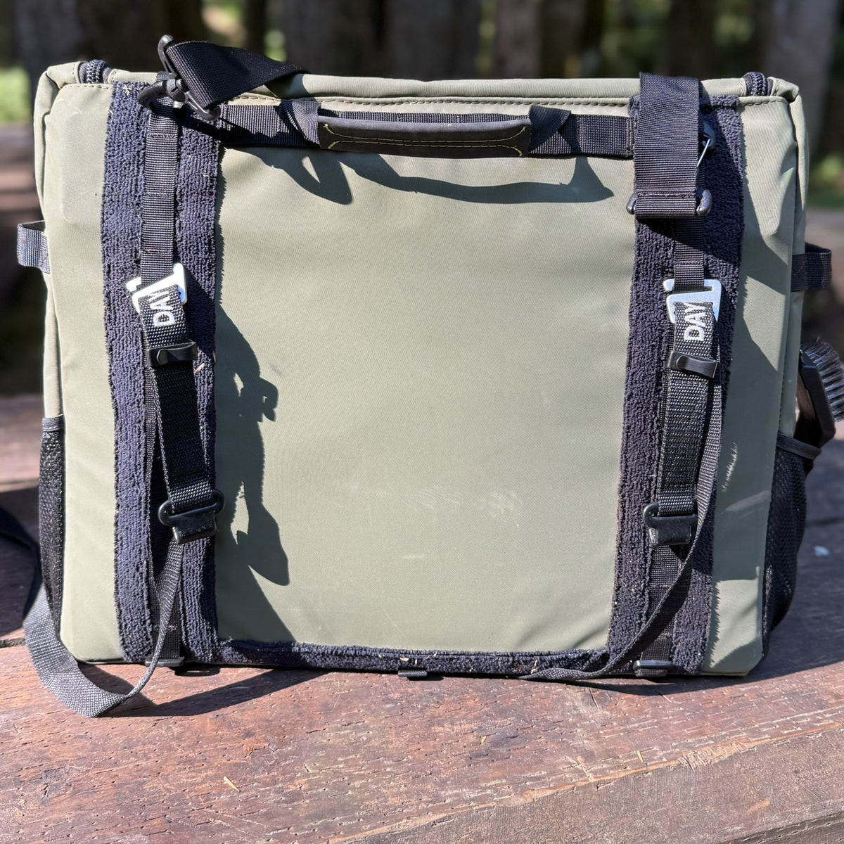 Back of a Workspace bag with the Universal Mounts flat-hook to G-hook straps clipped on